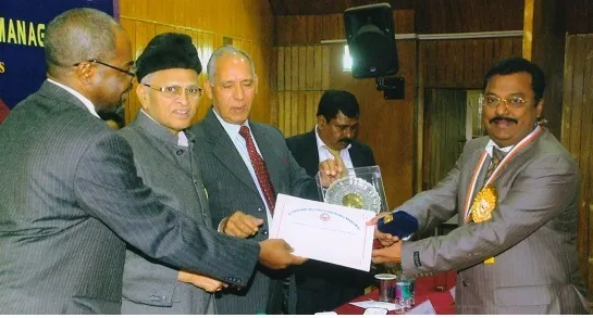 Receiving award from GVG Krishnamurthy